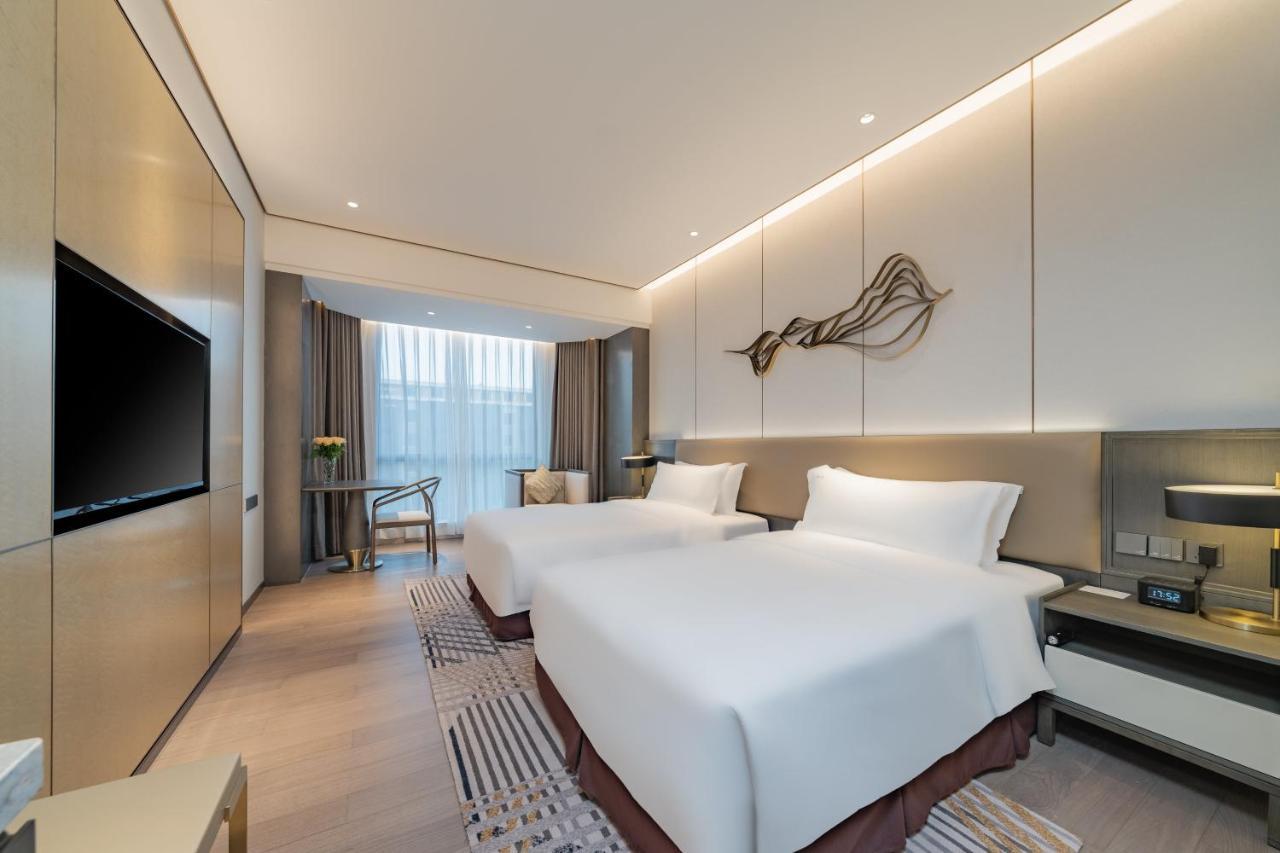 Holiday Inn Zhengzhou Zhongzhou By Ihg Экстерьер фото